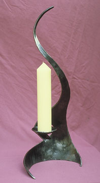 candlestick in metal and sculptural candle holder