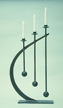 candlestick in metal in modern design, sculptural