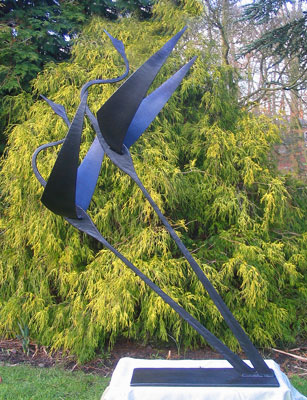 garden sculpture of flying birds