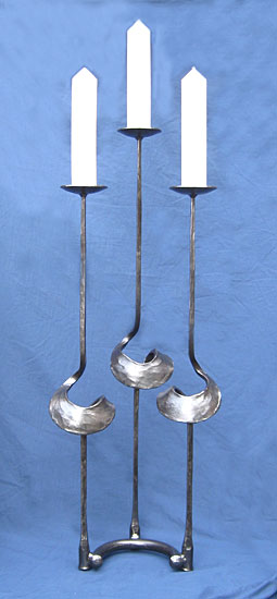 candlestick in metal, made by blacksmith