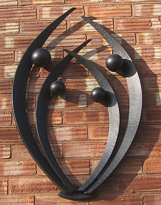 metal wall sculpture on a figurative theme