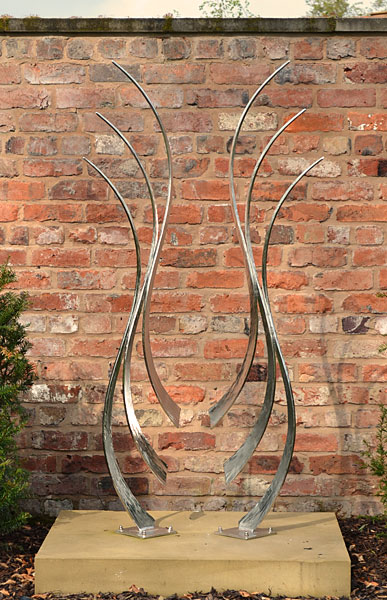 modern garden sculpture in stainless steel